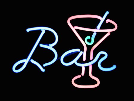 Neon bar martini cocktail sign on black backgroundの写真素材