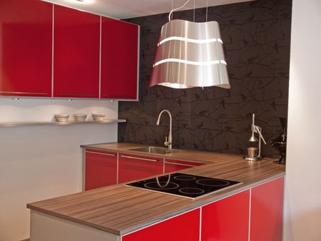 Modern design red kitchen with wooden counterの写真素材