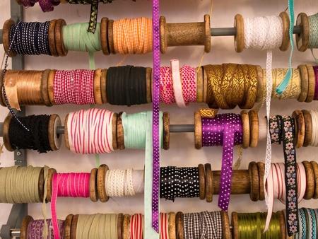 Variety selection of decorative colorful ribbons in hand craft shopの写真素材