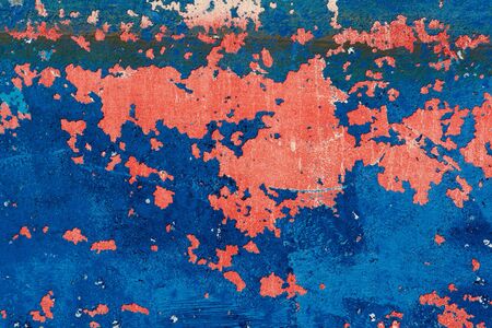 Rusty grunge aged steel iron paint on an old boat texture background in red and blue                               の写真素材