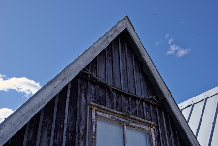 Beautiful black fishing huts on the coast Faaborg Denmarkのeditorial素材