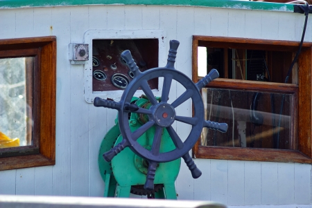 Beautiful traditional wooden ship steering wheel on a  sailing boatの写真素材