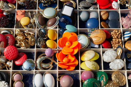 An assortment of colorful old vintage buttons for sale                               の写真素材