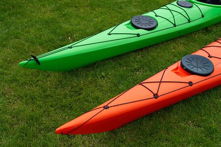 Colorful kayaks on the beach ready for extreme sport activityの写真素材
