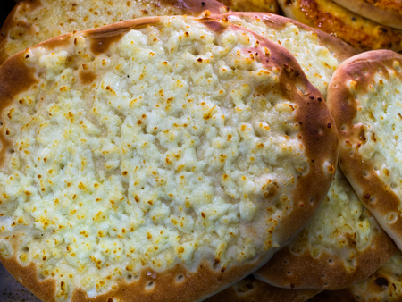 Cheese Manakish - Flat bread topped with cheese. Traditional typical famous Arab Middle East cuisineの写真素材