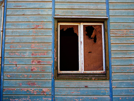 Details of an old weathered abandoned western colonial style wooden house shedの写真素材