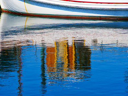 Reflection of a sale boat in the sea sailing sport background imageの写真素材