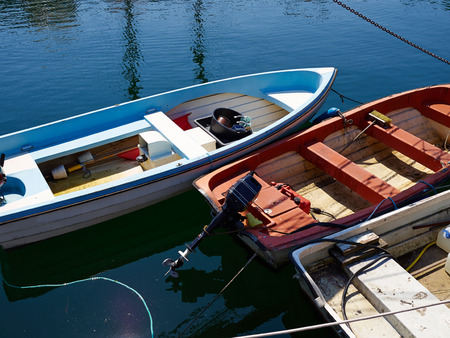 Typical traditional colorful small Danish fishing boat in a harbour at Funen Denmark