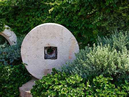 Beautiful classical Mediterranean garden with vibrant bright green color plants
