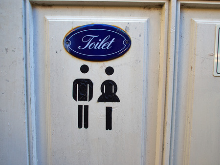 Old vintage classical style sign of public WC toiletの写真素材