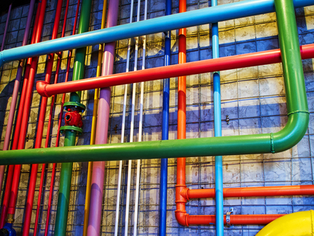 Pipes in bright strong colors great industrial modern background imageの写真素材