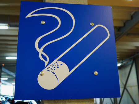 Designated blue graphic smoking area zone sign in a public buildingの写真素材