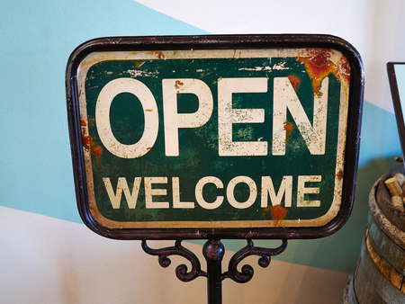 Classical vintage design style Open Welcome sign broad by the entry of a cafe restaurantの写真素材