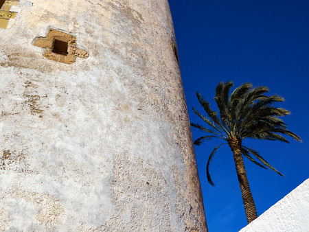 Famous attractive tourist attraction Torre Vigia Berber pirate watchtower Cabo Roig Orihuela Costa  Spainのeditorial素材