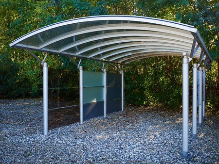 Modern carport car garage parking made of silver metal and glassの写真素材