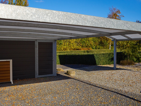 Modern carport car garage parking made of silver metal and glassの写真素材