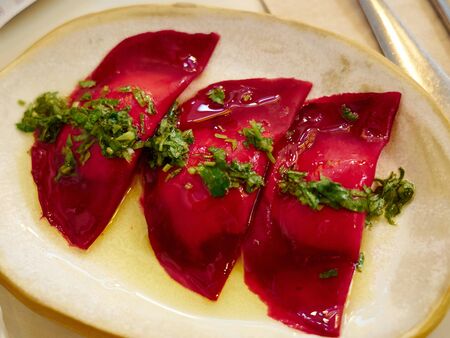 Red beet crepes stuffed with ricotta cheese classical dish from Italyの写真素材