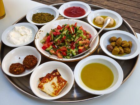 Arab Middle East Mediterranean Meze style breafast with salad, falafel, olives, Zaatar and cheeseの写真素材