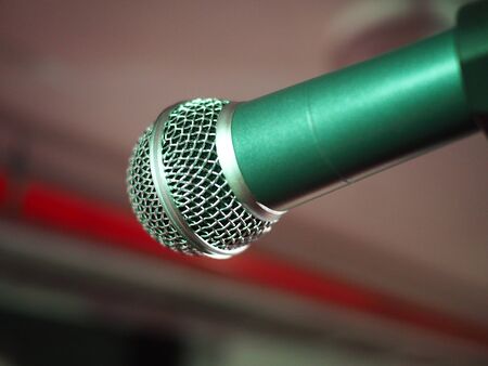 Closeup of classic microphone at concert on stage with shallow depth of fieldの写真素材