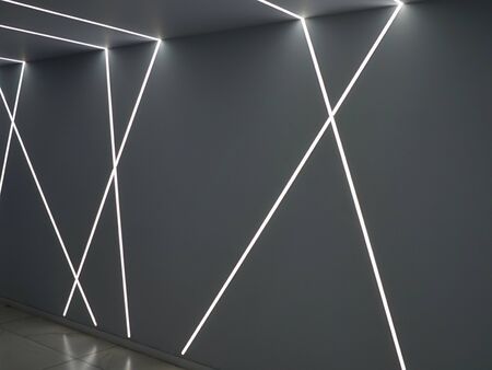Futuristic Abstract Architecture corridor with light stripes on gray wall in perspective viewの写真素材