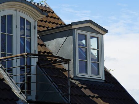 Modern design vertical roof window with white light metal covering                                                       の写真素材