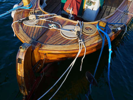 Typical traditional colorful small Danish fishing dingy boat in a harbour at Funen Denmark