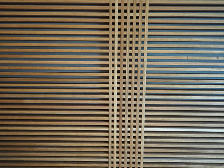 Modern trendy design wall wooden panel made of thin straight lines planksの写真素材