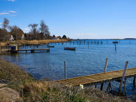 Small wooden pier jetty in Fyn Funen Denmark an attractive tourist vacation destination