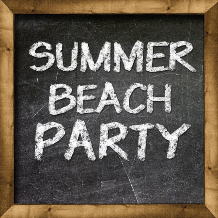 Summer beach party handwritten with white chalk on a blackboard の写真素材