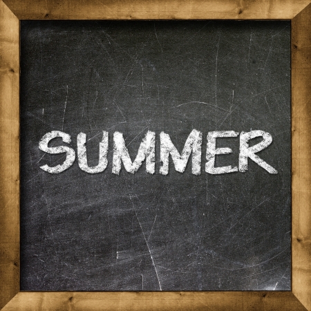Summer handwritten with white chalk on a blackboard の写真素材