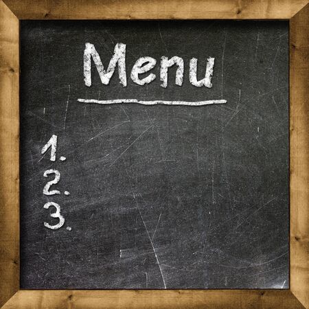 Menu title written with chalk on blackboardの写真素材