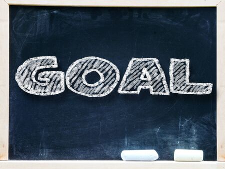 Goal handwritten with white chalk on a blackboard                   の写真素材