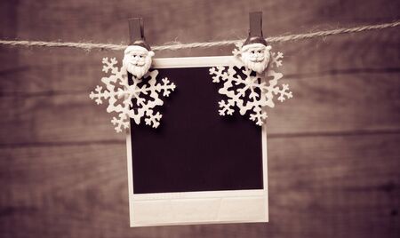 Old pictures on wood background with Christmas decoration