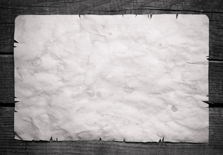 Vintage background with old paper on wooden backgroundの写真素材