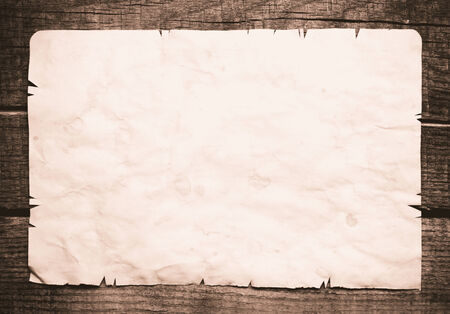 Vintage background with old paper on wooden backgroundの写真素材
