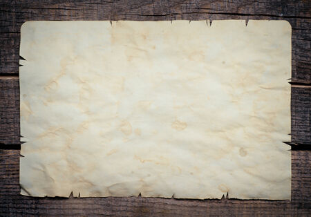 Vintage background with old paper on wooden backgroundの写真素材
