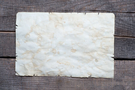Vintage background with old paper on wooden backgroundの写真素材