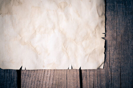 Vintage background with old paper on wooden backgroundの写真素材
