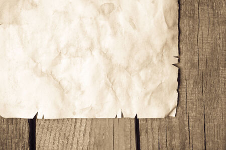 Vintage background with old paper on wooden backgroundの写真素材