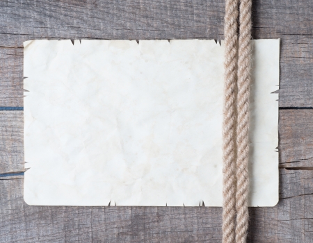 Ropes and old vintage ancient paper backgroundの写真素材