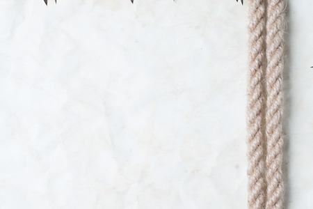 Ropes and old vintage ancient paper backgroundの写真素材