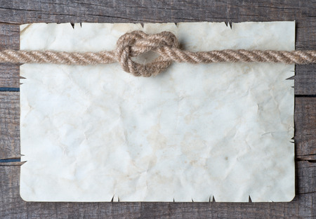 Ropes and old vintage ancient paper background の写真素材