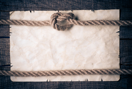 Ropes and old vintage ancient paper background の写真素材