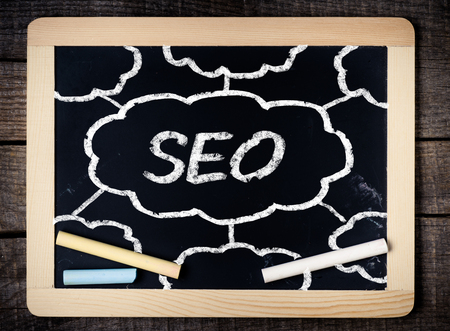 Blackboard with SEO Concept on wooden blackboard の写真素材