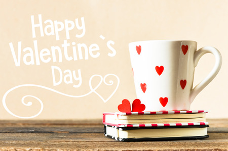 Happy valentines day concept with cup on  notebooksの写真素材