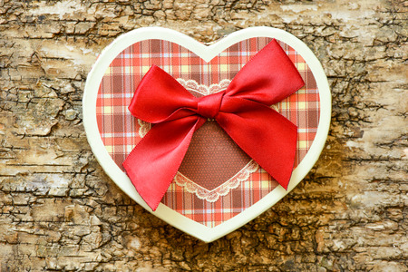 Heart on a wooden background. Background in the style of Valentine's Day. Heart on a wooden backgroundの写真素材