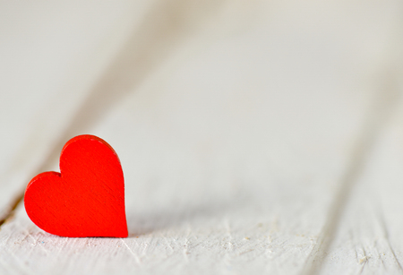 Heart on a wooden background. Background in the style of Valentine's Day. Heart on a wooden backgroundの写真素材