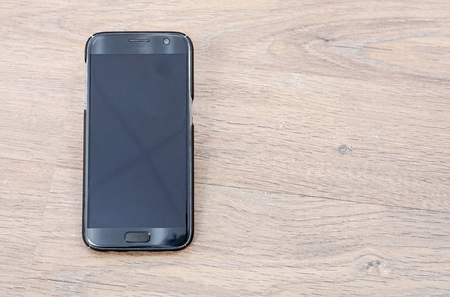 Smartphone on wooden backgroundの写真素材