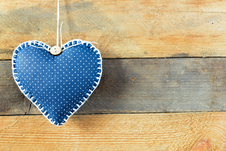 Heart on a wooden background. Background in the style of Valentine's Day. Heart on a wooden backgroundの写真素材