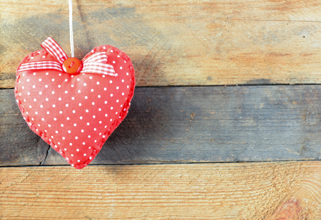 Heart on a wooden background. Background in the style of Valentine's Day. Heart on a wooden backgroundの写真素材